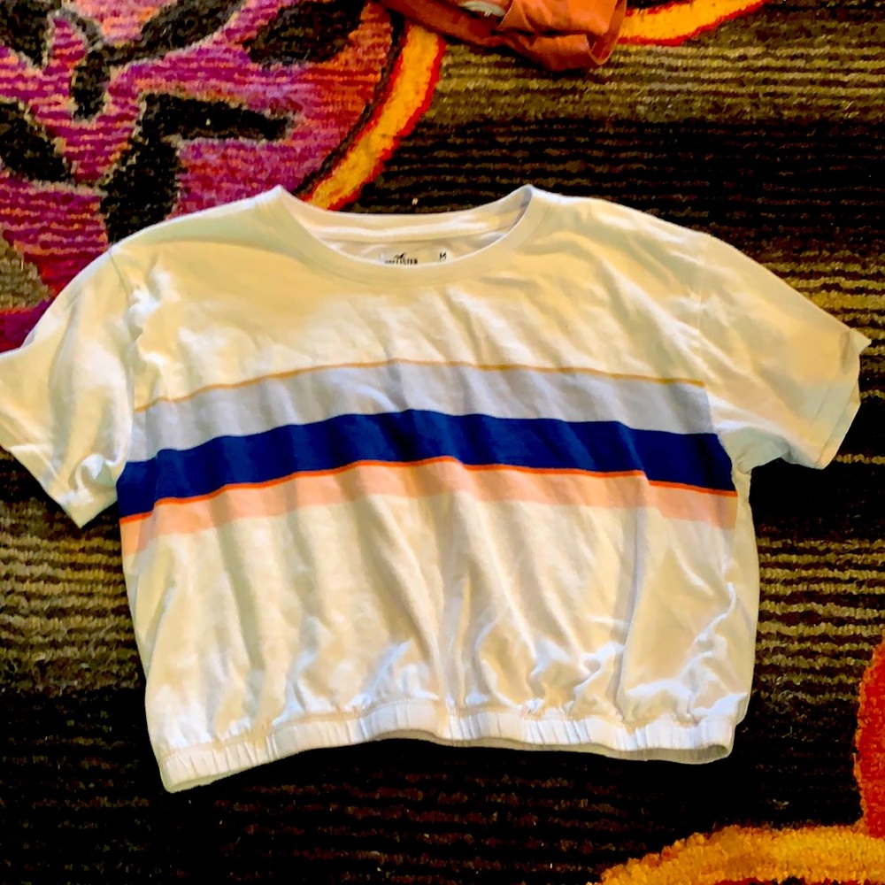 A white with colorful stripes t-shirt